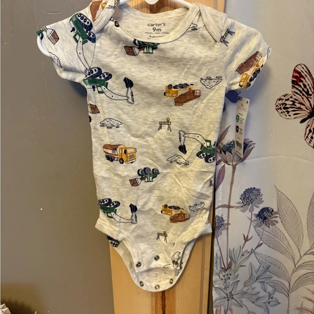 Carter's Cream Bodysuit with Animal Design.  5 size 9 months onesies for $15